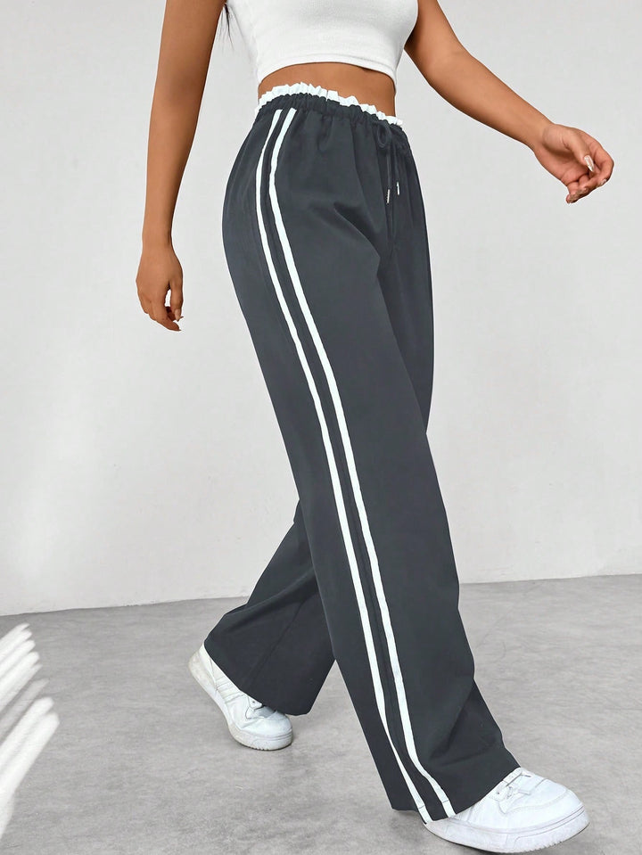 Nyvara | Women’s Wide-Leg Trousers with stripe running along the sides