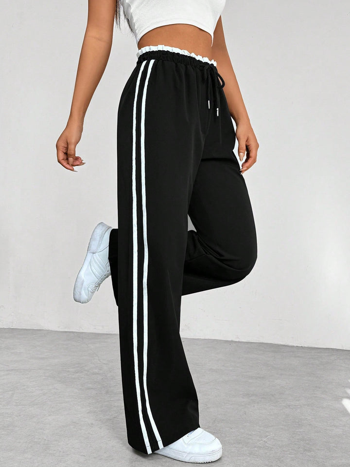Nyvara | Women’s Wide-Leg Trousers with stripe running along the sides