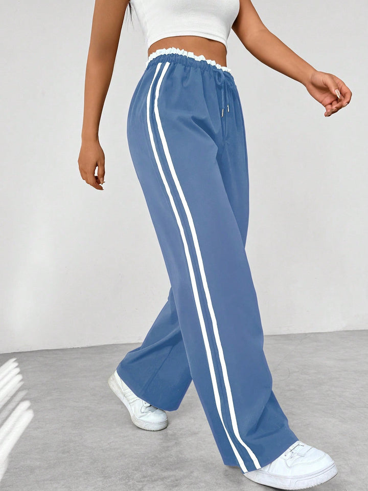 Nyvara | Women’s Wide-Leg Trousers with stripe running along the sides